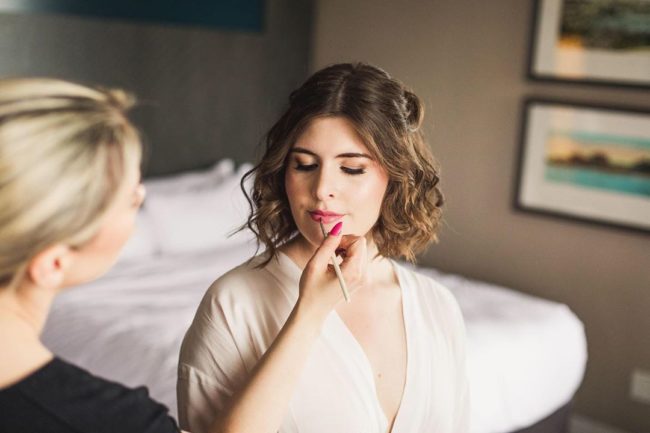 Bride getting makeup done